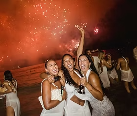 JetQuest group cheersing on New Year's Eve in Copacabana